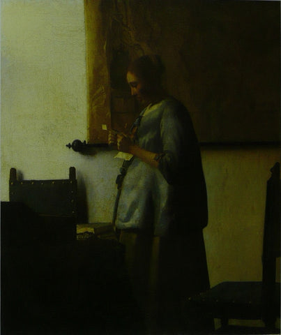 Woman in blue reading a letter Vermeer