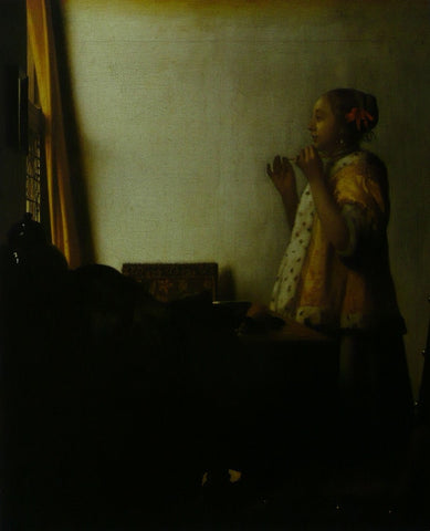 Woman with a pearl necklace Vermeer