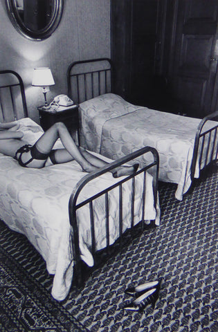JeanLoup Sieff  Stocking covered Legs on Bed