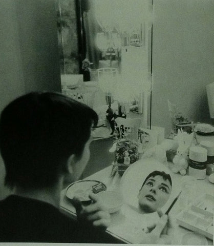 Audrey Hepburn in a make up room