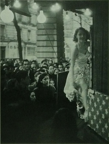 Young girl in foreground with crowd behind her
