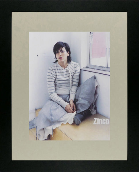 Zinco Lady sitting in seat by window (Advert)