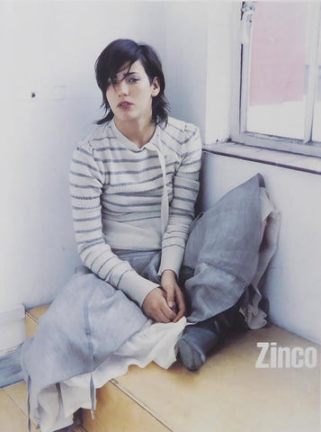 Zinco Lady sitting in seat by window (Advert)