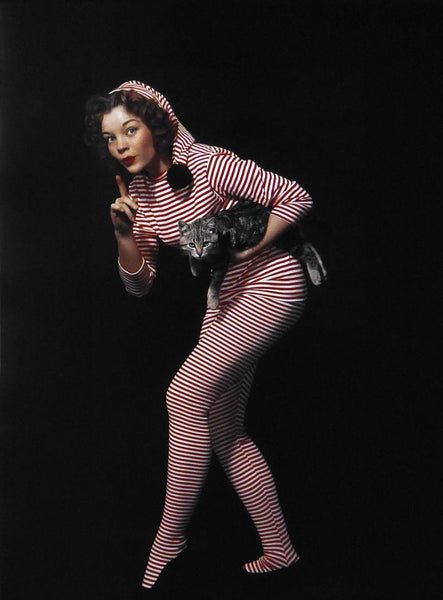 unknown lady in stripes with a cat 